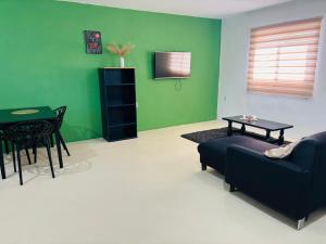 a living room with a couch and a table at sol appartement 3 in Willemstad