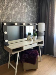 a dressing table with a mirror on top of it at Alvooria Living in Tapa