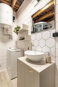 a white bathroom with a sink and a counter at Ale Jazz w cenie jacuzzi i basen in Nowe Miasto +115 photos