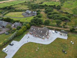 an aerial view of a large house with a yard at B&B Kerry Lakesview Lodge in Waterville