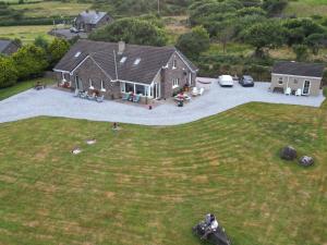 an aerial view of a house with a large yard at B&B Kerry Lakesview Lodge in Waterville