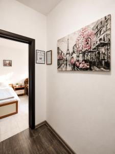 a room with a painting hanging on the wall at AnaBella Apartments Gabrovo in Gabrovo
