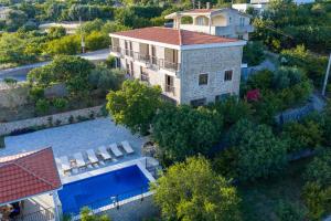 an aerial view of a house with a swimming pool at Amd Ville Apartments in Dobra Voda