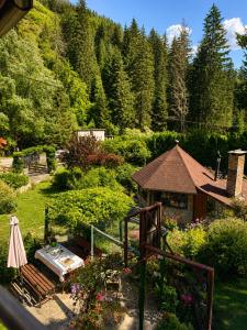 a view of a garden with flowers and a building at Weekend house Grahovača in Rožaje
