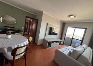 a living room with a table and a white couch at Alojamiento Center in Barraquero