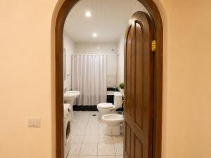 a bathroom with two toilets and two sinks at Sunshine Boutique Hostel in Yerevan
