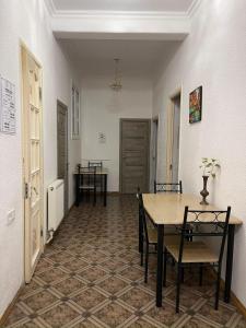 a dining room with a table and chairs at Green Hostel in Yerevan