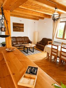 a living room with a couch and a table at Hiža Bili in Svetvinčenat