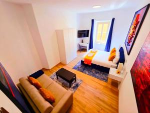 a living room with a couch and a bed at Baglioni Art Suite in Perugia +50 photos
