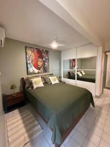 a bedroom with a large bed in a room at Flamingo Bay in Les Trois-Îlets
