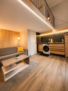 a living room with a couch and a table at ZONA NAVIGLI Design Loft , Proiettore schermo 80" in Milan