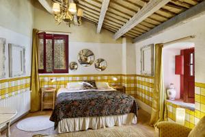 a bedroom with a bed and a table in it at Mas Ferrer Petit by 123ole in Sant Andreu del Terri