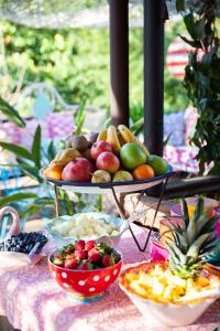 a table with a tray of fruit on a table at Mas Ferrer Petit by 123ole in Sant Andreu del Terri