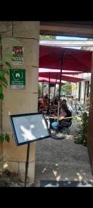 a ping pong table in front of a restaurant at Le Garage, La Chambre in Fontevraud-l'Abbaye