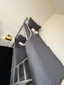 a bedroom with a bunk bed in a room at MBZ - Boutique Bed Space in Muşaffaḩ