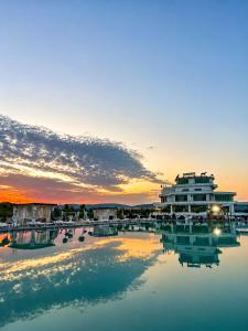 a view of a marina at sunset at Hipodrum Kompleks in Suharekë