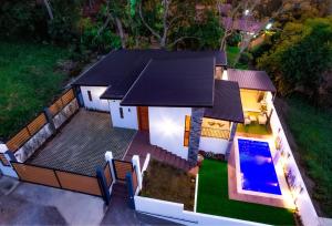 an aerial view of a house with a swimming pool at villa serenity in Jarabacoa