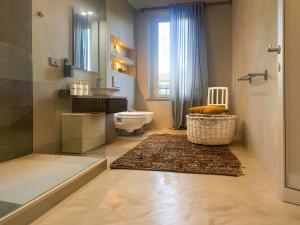 a bathroom with a toilet and a sink and a shower at Signature Design & Panoramic Views in Montecatini Terme