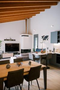 a living room with a couch and a table at Odysseas Seaside Escape by Philoxenia in Artemida