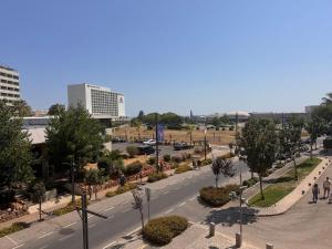 a view of a street with trees and buildings at Vilamoura Marina Beach Apartament in Quarteira +3 photos