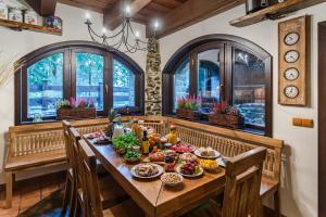 a table with food on it in a room with windows at Medvědí skála in Čeladná