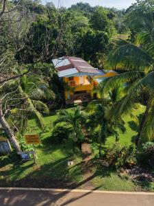 an aerial view of a house with palm trees at Los Tecales Hostal in Santa Catalina