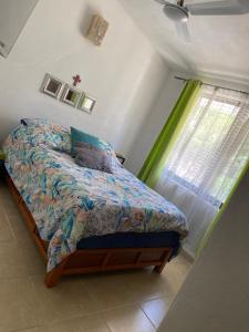 a bedroom with a bed and a window at Casa Palma in Santa Cruz Huatulco +17 photos