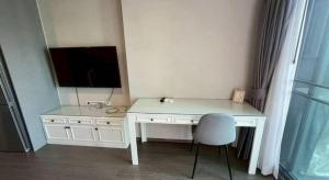 a white desk with a television and a chair at Hotel Luxe Elite in Chhatikara