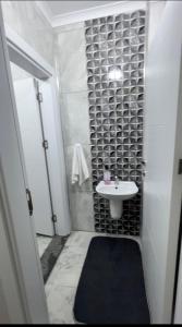 a small bathroom with a sink and a toilet at My Trabzon trend house in Trabzon