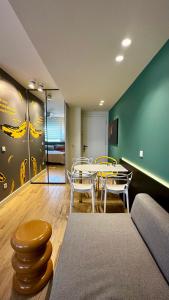 a dining room with a table and chairs in a room at Samothraki Belize Luxury Apartments in Samothraki