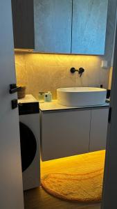 a bathroom with a white sink and a counter at Samothraki Belize Luxury Apartments in Samothraki +26 photos