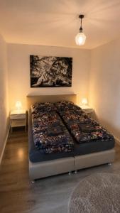 a large bed in a bedroom with at Hinterhaus am Schloss Karlsruhe in Karlsruhe +12 photos