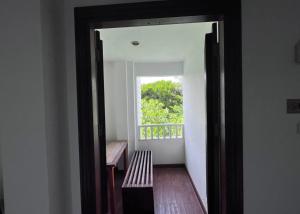 an open door to a room with a window at Hotel Park Star Premium Rooms in Tājganj