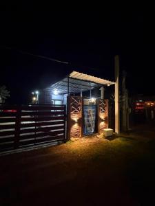 a building with a sign in front of it at night at My Ideal in Balneario Argentino
