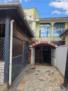 a building with a sign that reads shawnna twins at Samana hotel ukonga in Dar es Salaam