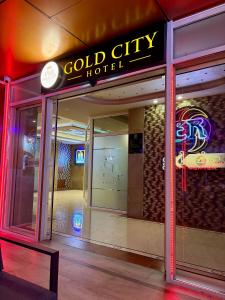 a store front with a sign for a gold city hotel at Gold City Hotel by Erebara in Debar