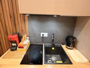 a kitchen with a sink and a counter top at Brianza Home in Giussano +113 photos