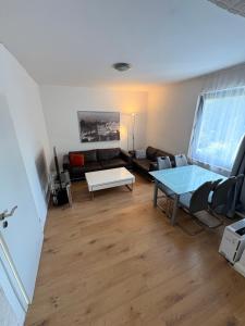 a living room with a couch and a table at Wohnung in herzogenrath-strass für max 4 Gäste in Herzogenrath