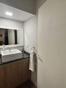 a bathroom with a sink and a mirror at Cabañas El Viejo Sauce in Tandil +65 photos
