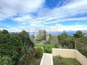 a view of a garden with bushes and trees at Azure Theologos Villa in Theologos