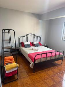 a bedroom with a bunk bed and a ladder at S Vicente Live in Mindelo