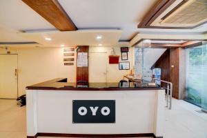 an oo sign on a counter in a room at Hotel O Ganpati in Bhopal