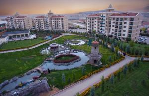 an aerial view of a resort with a park at Grand Ozgul Thermal Holiday Village in Gazligol