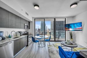 a kitchen and dining room with a view of a city at The Sanctuary King studio in Miami