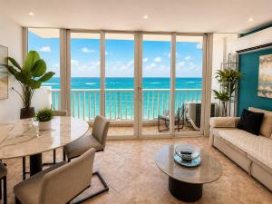a living room with a view of the ocean at Beachfront Stella Maris Apt on Condado Ave in San Juan