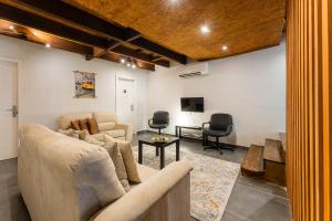 a living room with a couch and a table at GuestReady - Porto Home GuestHouse in Porto +30 photos