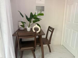 a table and chairs with a plant on it at Diamond House in Srithanu in Srithanu +19 photos