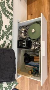 a white cabinet with a drawer filled with items at Mustang Studios in Canberra +11 photos