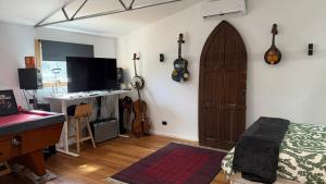 a room with a room with guitars on the wall at Mustang Studios in Canberra