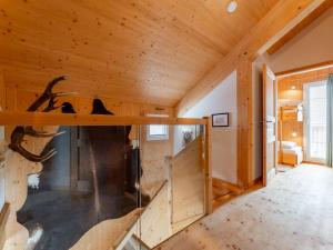 a log cabin with a staircase in a room at Bärenschanze in Hohentauern +38 photos
